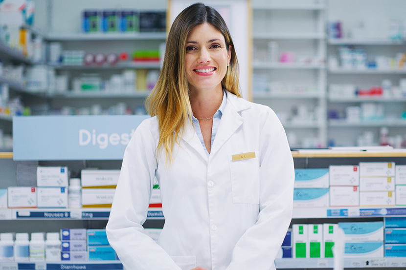 Pharmacy resident student smiling with white coat