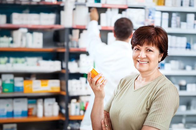 Patient holding a medication at pharmacy